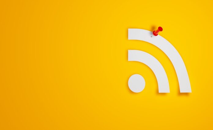 Pin Paper RSS Symbol on Yellow Background